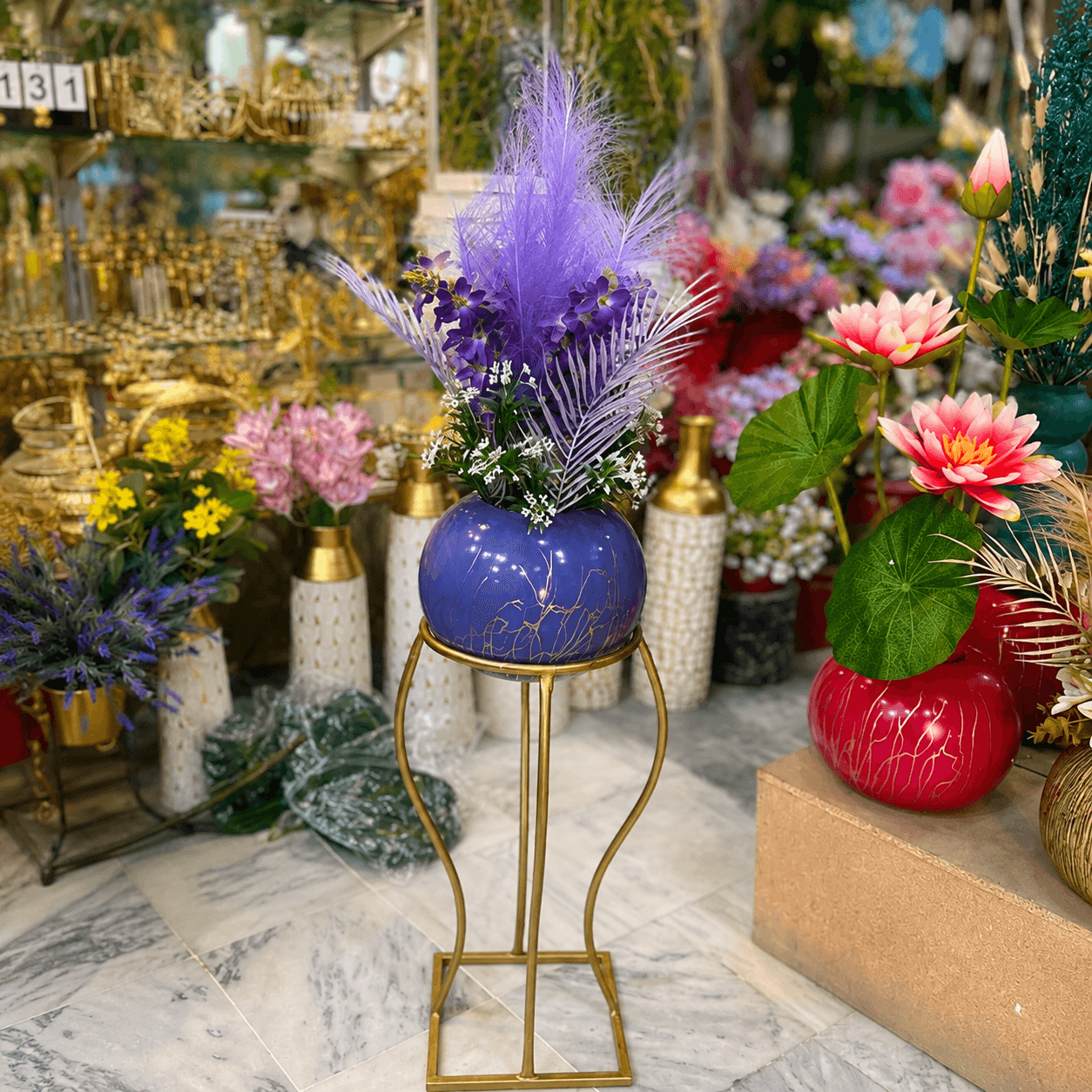 Purple Floral Arrangement in Chalk Bowl with Gold Metal Stand