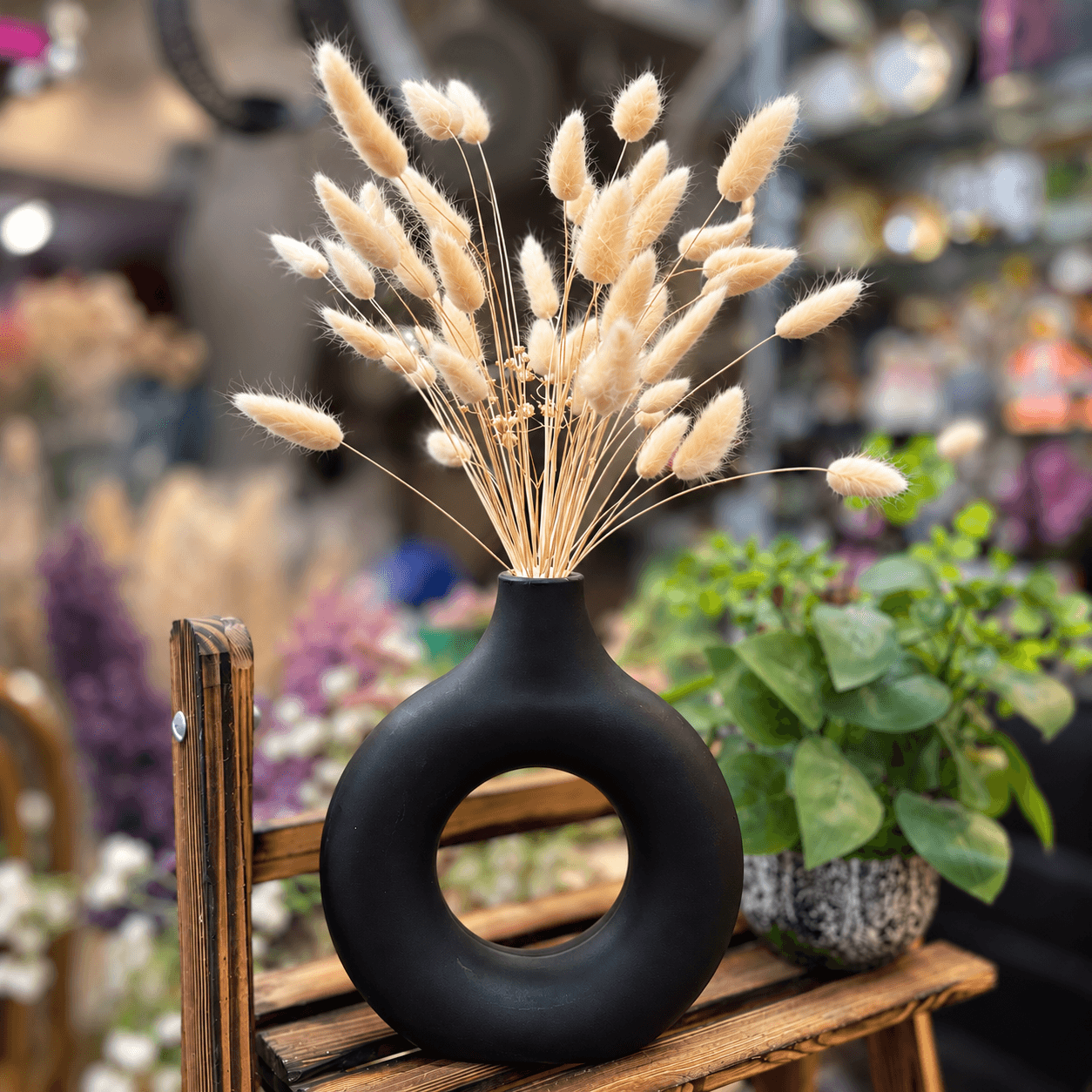 Plastic Donut Vase with Dried Bunny Tails