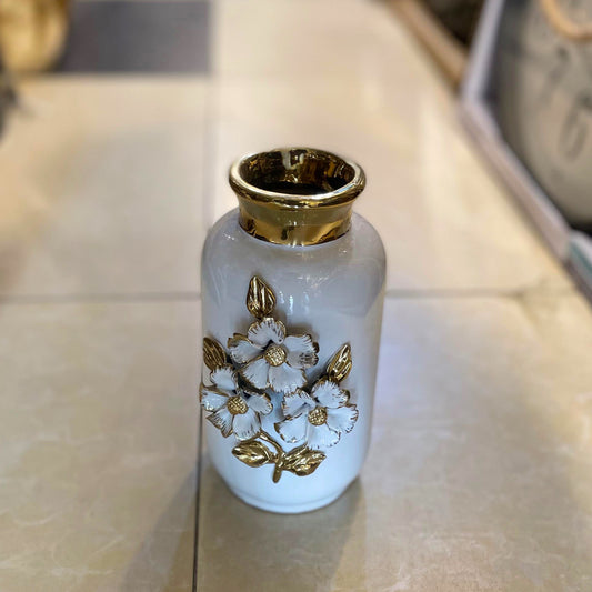 white ceramic flower vase accented with luxurious gold detailing and 3D floral